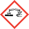 Test tubes dripping liquid symbol in a red diamond border indicating a corrosive item